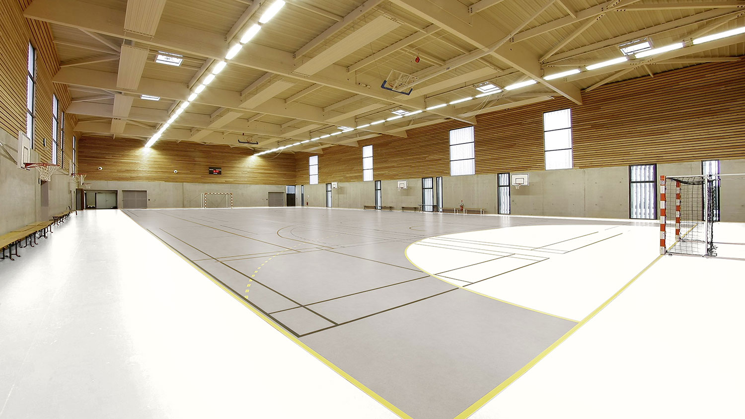 Пример укладки износостойкого спортивного линолеума Tarkett Concrete Cool Grey в универсальном крытом зале