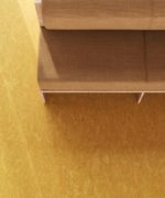 Натуральный линолеум Tarkett Lino Loose Lay Veneto Sunflower 628 подсолнечно-желтого цвета в интерьере, ракурс у мягкого дивана вид сверху