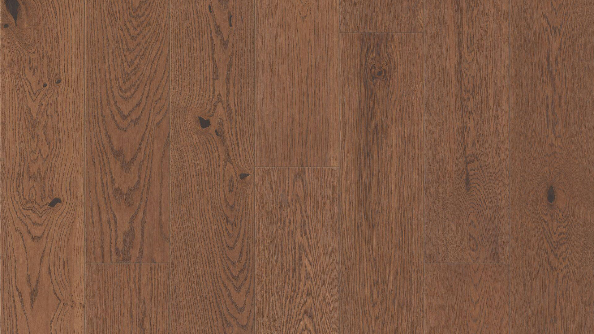 Крупный план раскладки панелей паркетной доски Sommer Classic Plank в коричневом оттенке дуба.