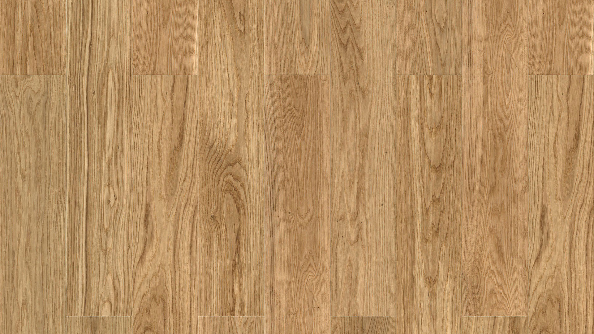 Крупный план паркета Tarkett Step Oak Baron наглядно демонстрирует классический рисунок годовых колец и текстуру дуба в натуральном медовом цвете.