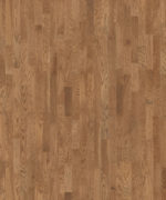 Детализированный образец Tarkett Salsa Premium Oak Oniks крупным планом передает естественную древесную структуру золотисто-коричневого дуба.