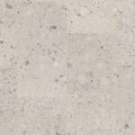 SPC-плитка Tarkett Element Click Toffee Glaze бежевого оттенка. Текстура напольного покрытия с имитацией конгломерата или камня крупным планом.