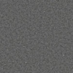 Гомогенный линолеум Tarkett iQ Granit 0194 с мелкозернистой направленной текстурой в темно-серых и графитовых тонах крупным планом.